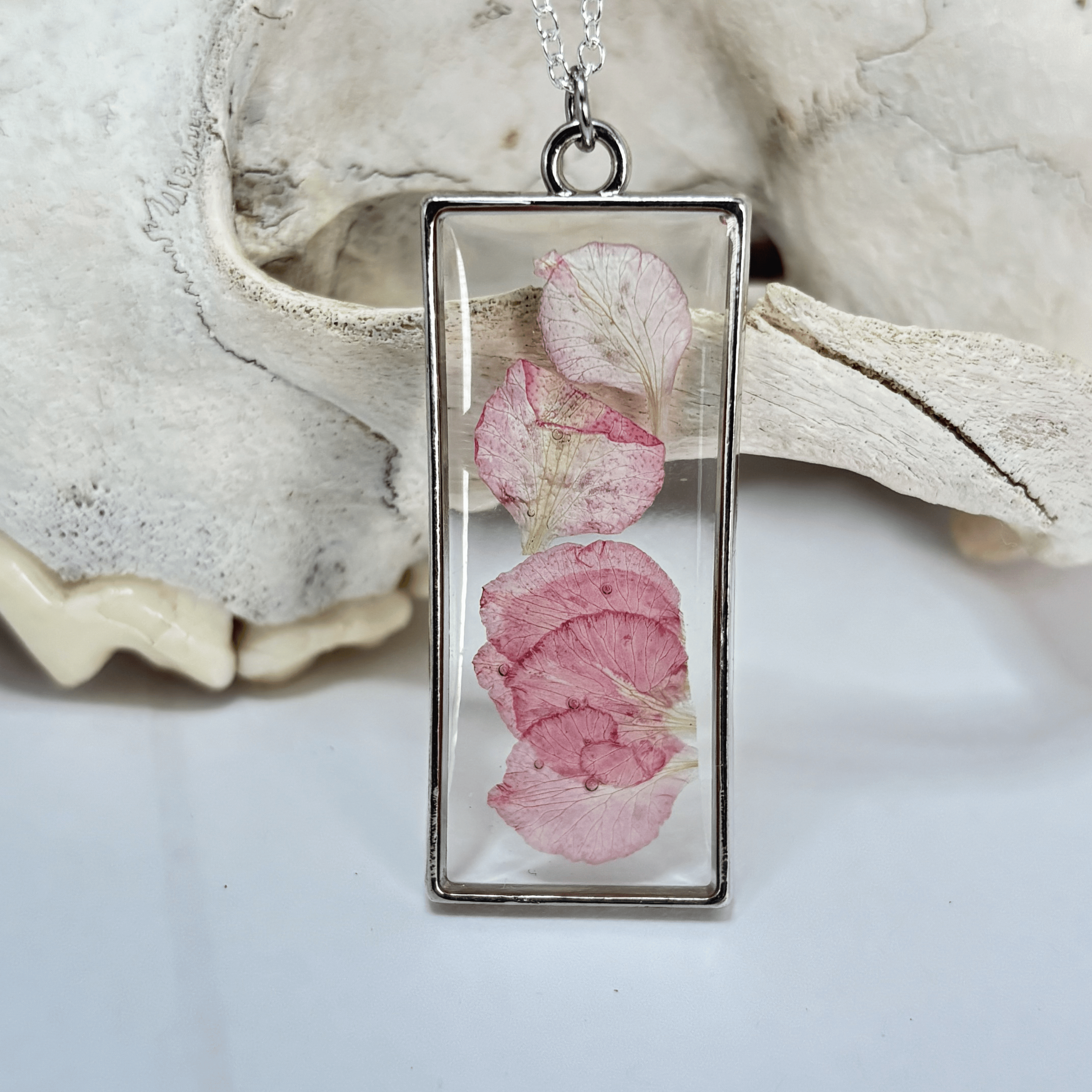 Rectangular pendant with pink floral design